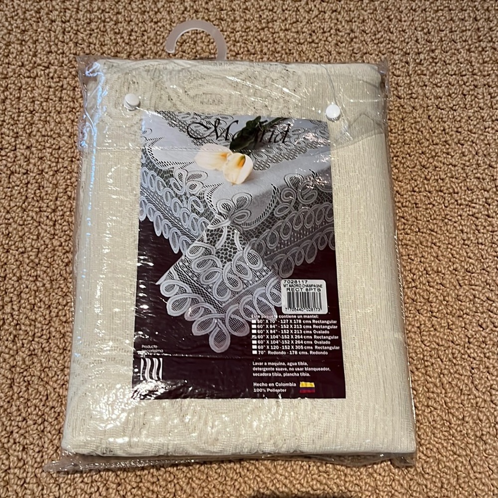 champagne lace tablecloth new in package! Size 60"x 104" rectangular